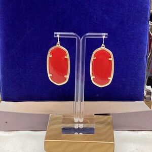 Gold tone and red earrings